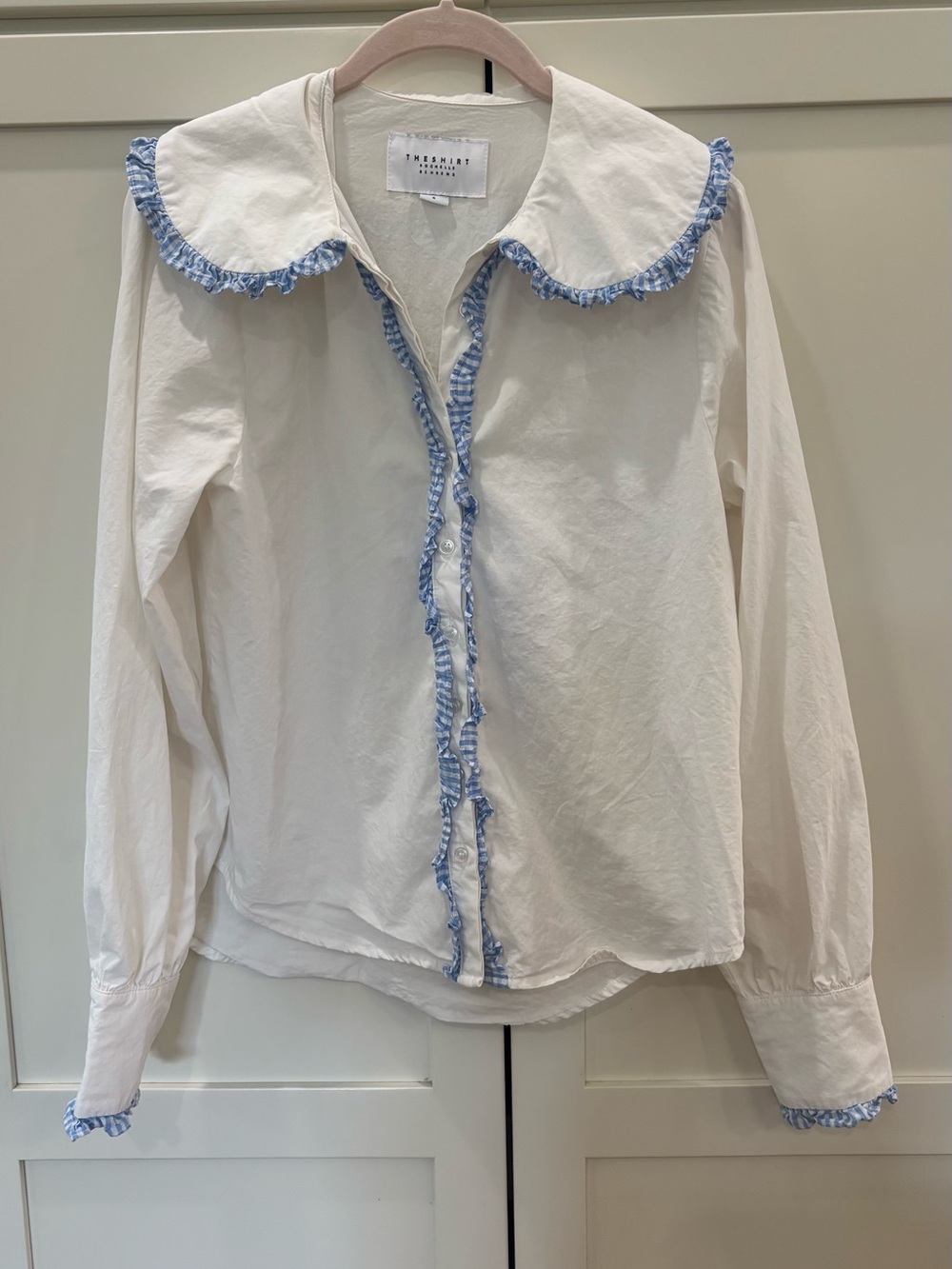 The Shirt by Rochelle Behrens White Blouse with Blue Ruffle Trim